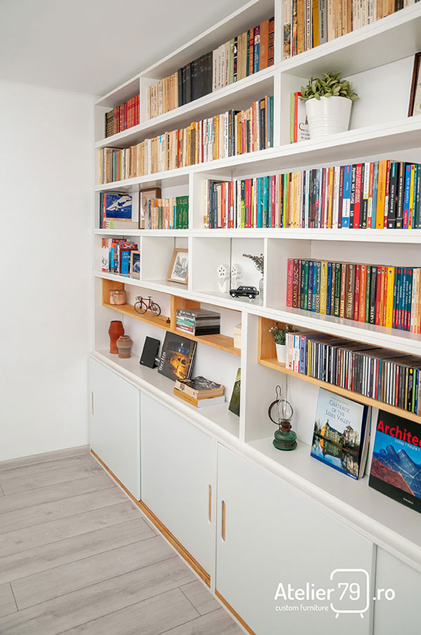 Biblioteca realizata la comanda din lemn masiv, PAL si MDF vopsit alb.