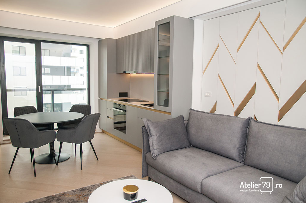 Mobila apartament rezidential. Bucatarie design contemporan realizata la comanda. MDF vopsit gri, blat de bucatarie compozit si feronerie premium.